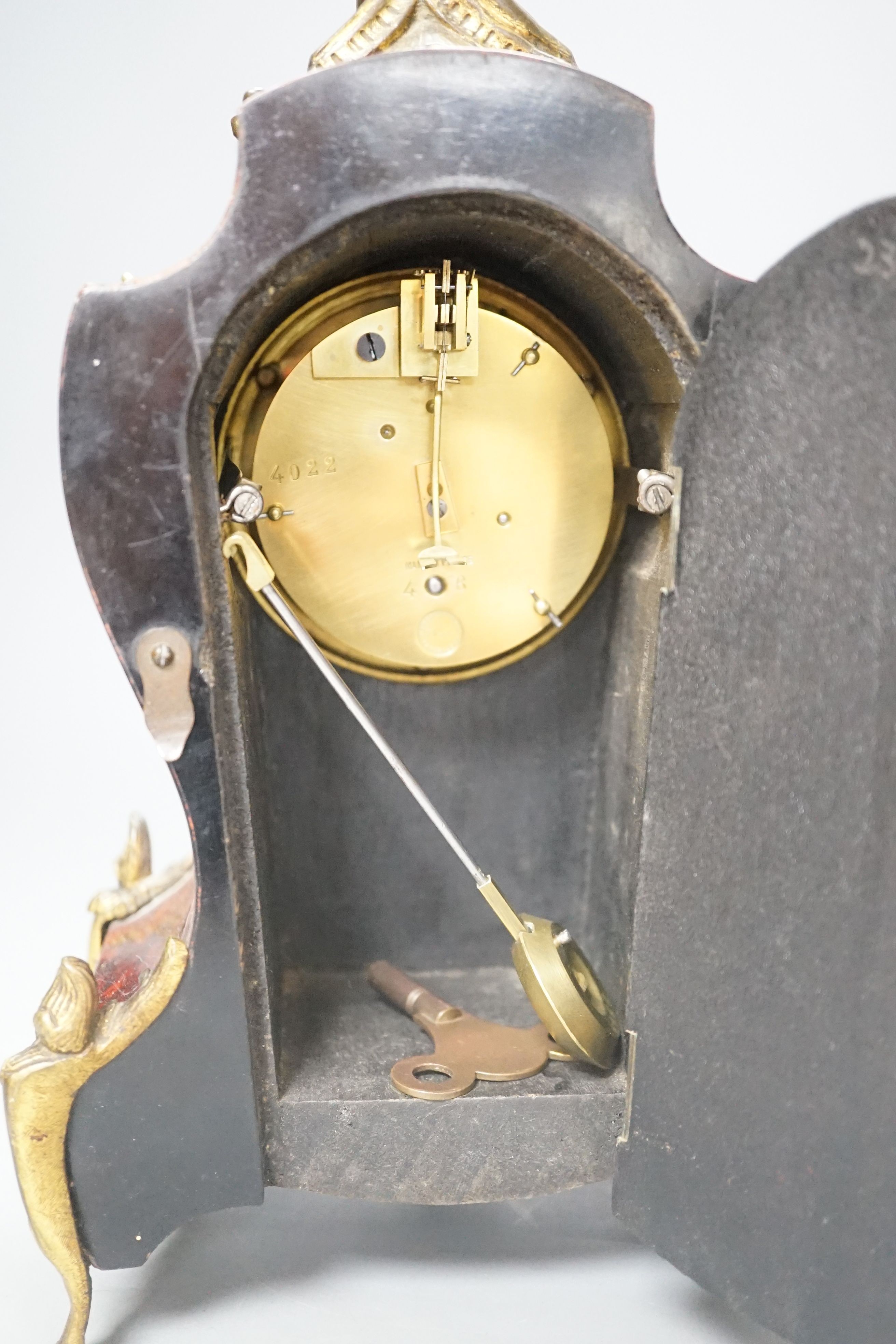 19th century French tortoiseshell veneered mantel clock, 31cms high.